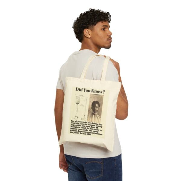 Man carrying a tote bag with a black woman inventor on it.