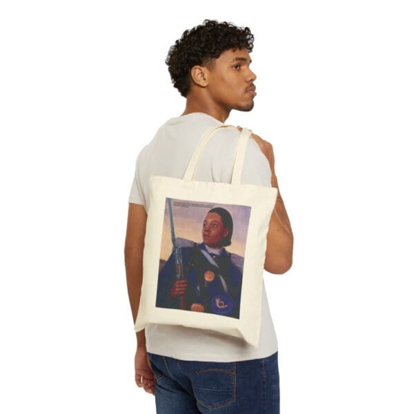 Man holding a tote bag with a painting of a soldier.