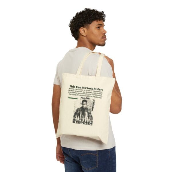 Man carrying tote bag with Black History design.