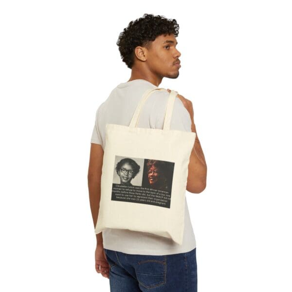 Man holding a tote bag with a photo of Claudette Colvin.