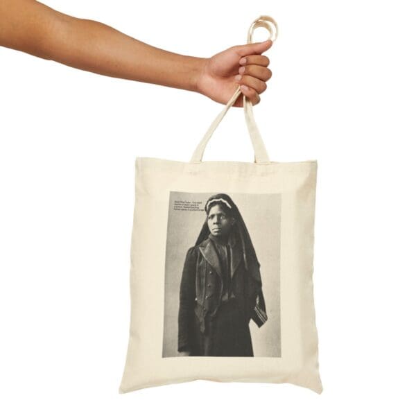 Beige tote bag with black and white photo of a woman.