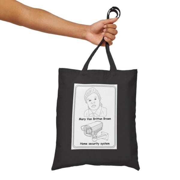 Black tote bag with a security camera design.