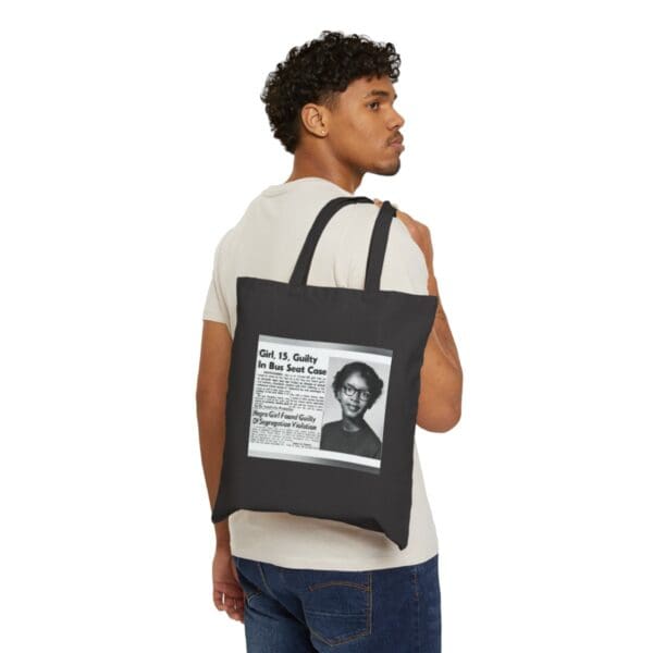 Black tote bag with a photo of a young girl.