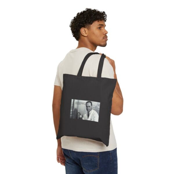 Black tote bag with a photo of a man.