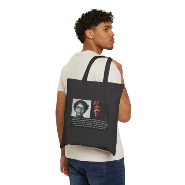 Man holding a tote bag with a picture of Claudette Colvin.