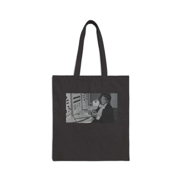 Black and white tote bag with a woman on it.