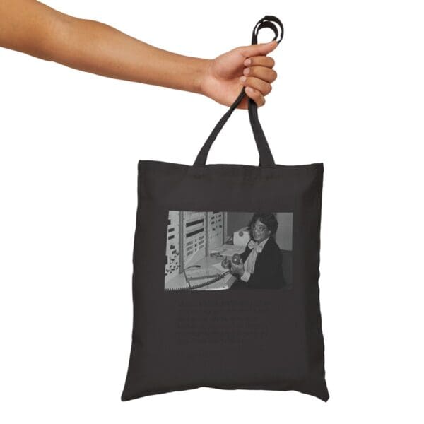 Black tote bag with a photo of a woman.