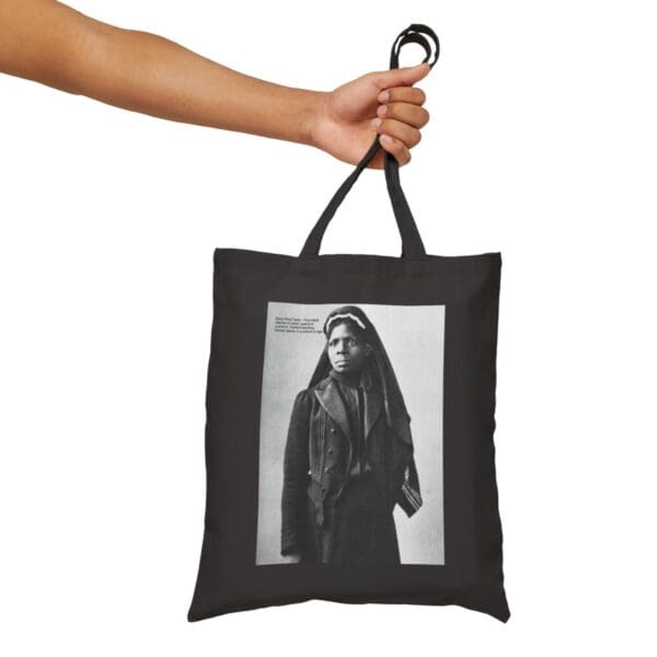 Black tote bag with a portrait of a woman.