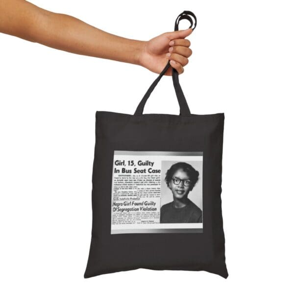 Black tote bag with "Girl, 15, Guilty in Bus Seat Case" newspaper clipping.