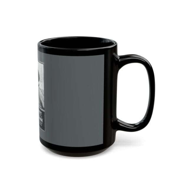 Black mug with a photo and text.