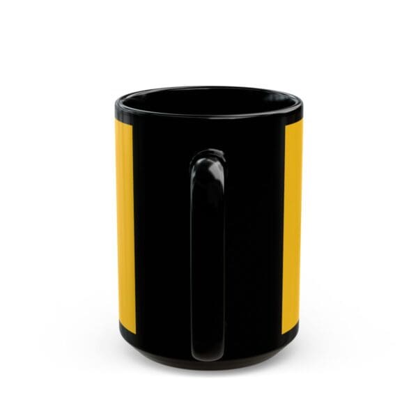 Black mug with yellow stripe and handle.