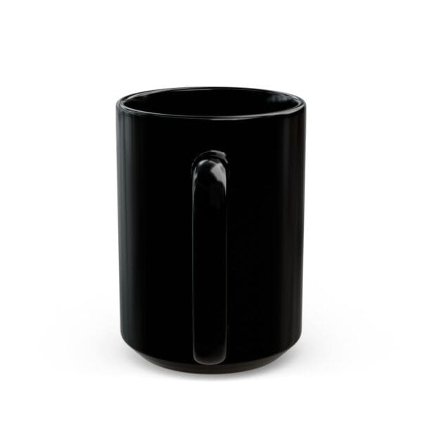 Black ceramic mug with a handle.