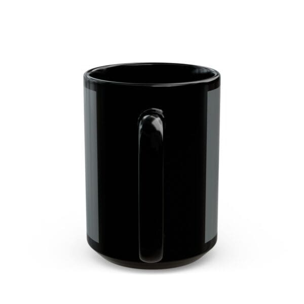 Black coffee mug with a handle.