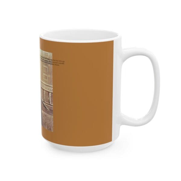 White coffee mug with brown design.