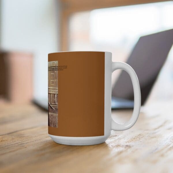 White mug with a brown design.