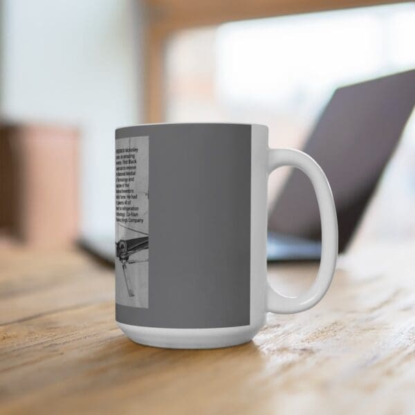 White coffee mug with a black and white design.