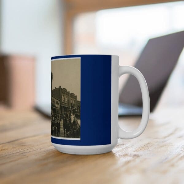 White mug with vintage town scene.