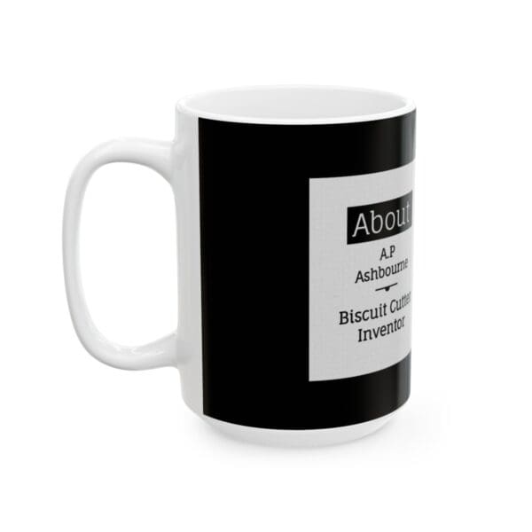 White mug with black text about biscuit cutter inventor.