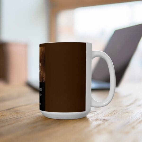 White coffee mug with brown design.