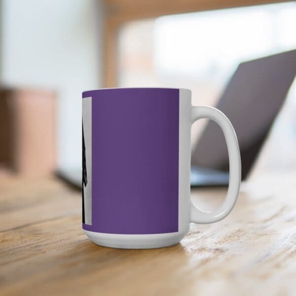 Purple mug with black and white design.