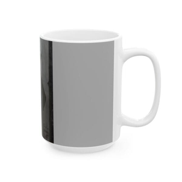 White ceramic mug with gray design.