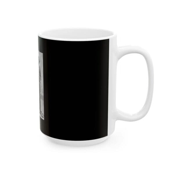 White coffee mug with black photo.