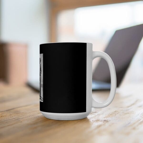 White mug with black image of a man.