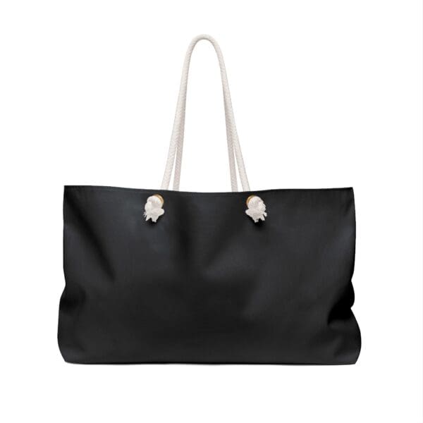 Black tote bag with white rope handles.