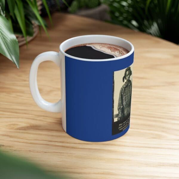 Blue coffee mug with a photo of a girl.