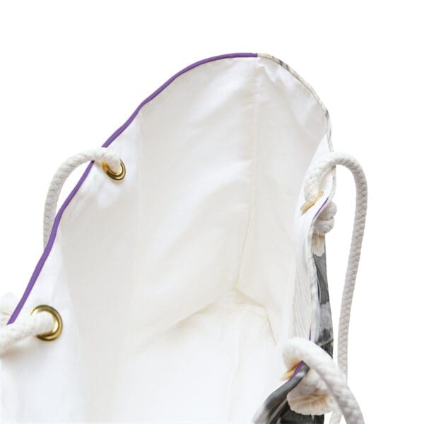 White canvas tote bag with purple trim.