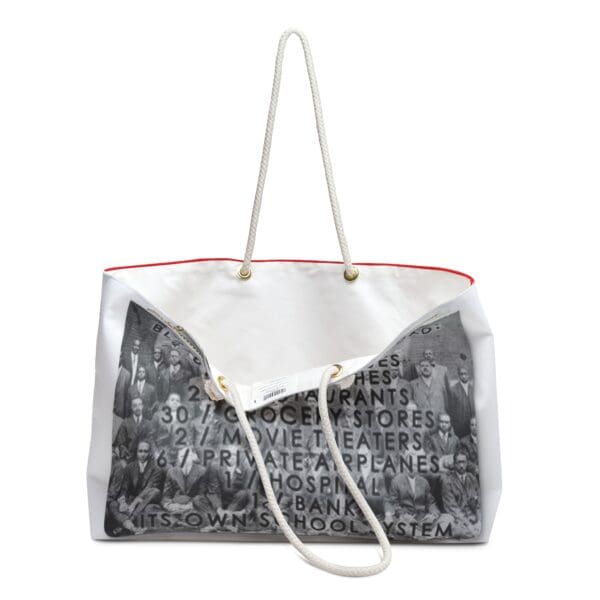 White canvas tote bag with a red trim.