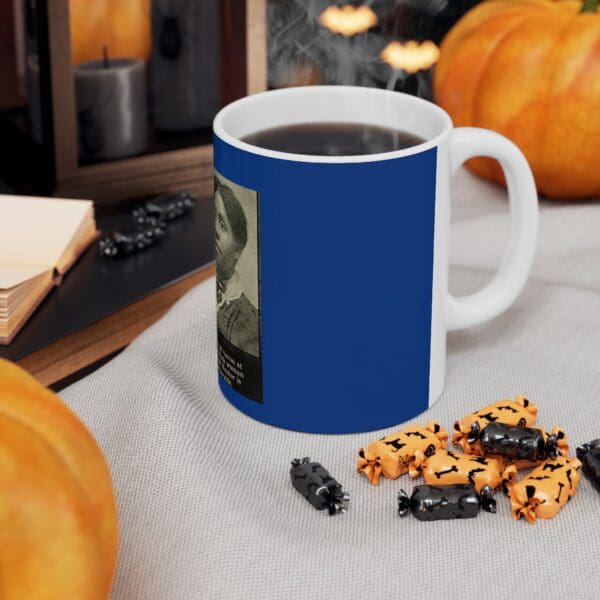 Blue mug with woman and candy.