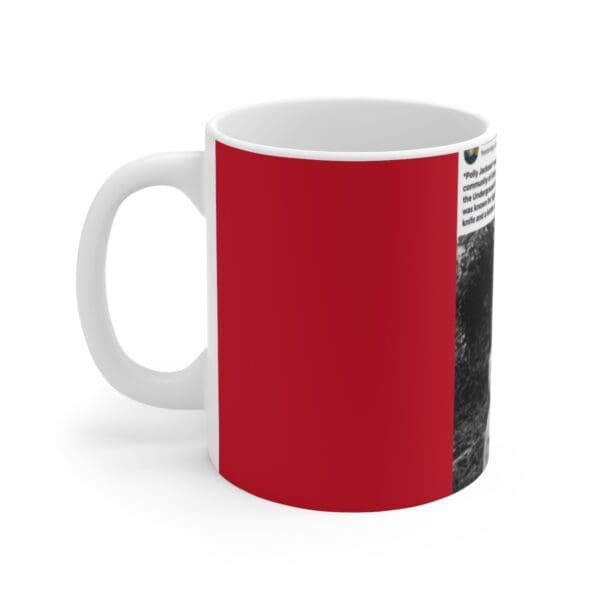 Red mug with black and white image.