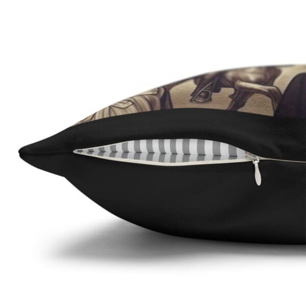 Black pillow with zipper and striped lining.