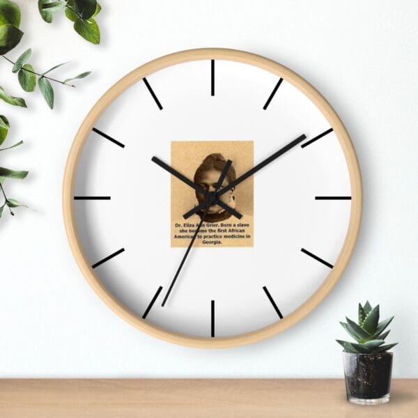 Clock with Dr. Eliza Ann Grier portrait.