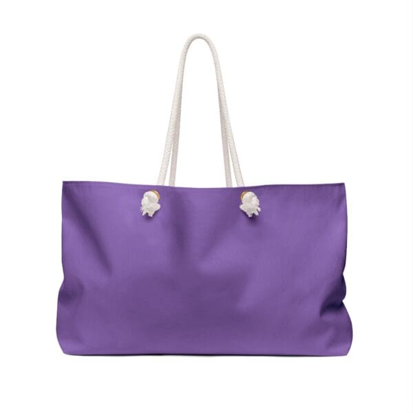 Purple tote bag with white rope handles.