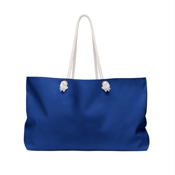 Blue canvas tote bag with white rope handles.