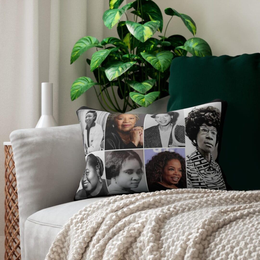 Black and white pillow with portraits of women.