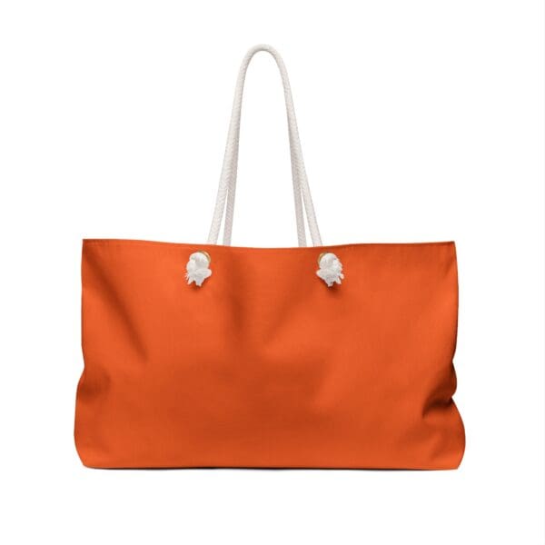 Orange tote bag with white rope handles.