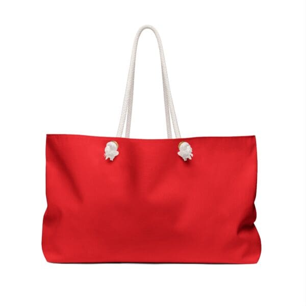 Red tote bag with white rope handles.