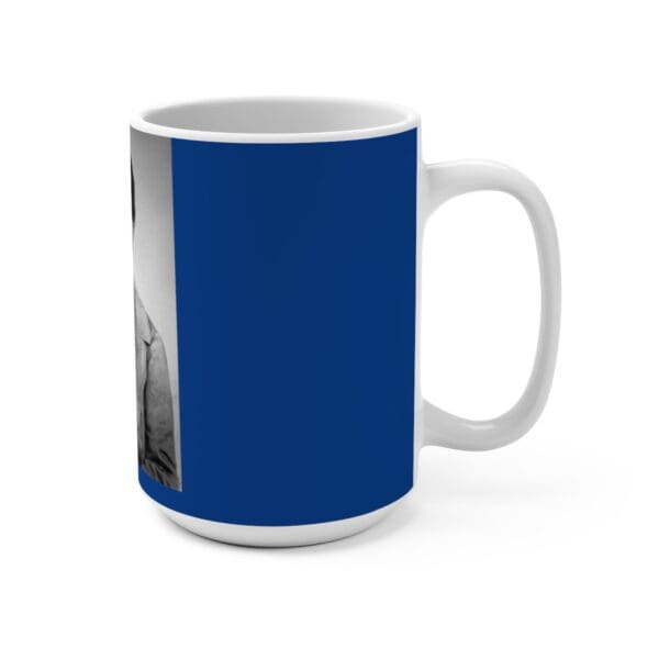 White mug with blue background and a man's portrait.