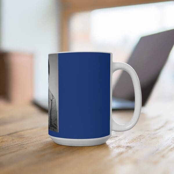 White mug with a blue design and a picture.