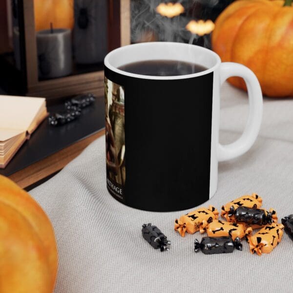 Black mug with coffee and Halloween candy.