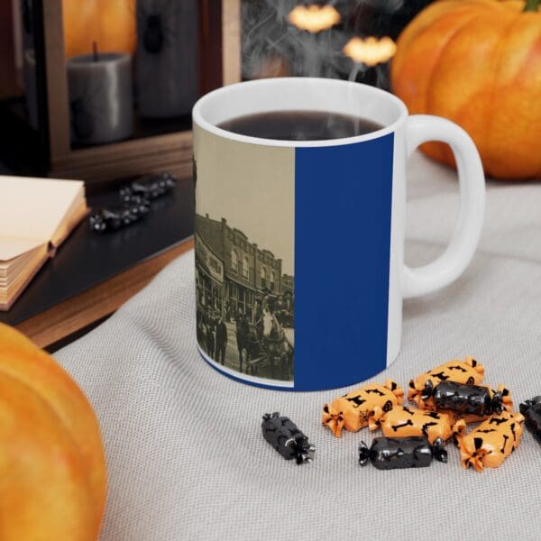 White coffee mug with vintage town scene.