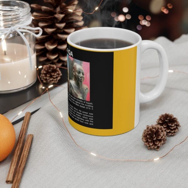 White coffee mug with black and yellow design.