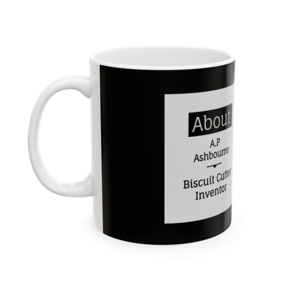 White mug with black text about biscuit cutter inventor.