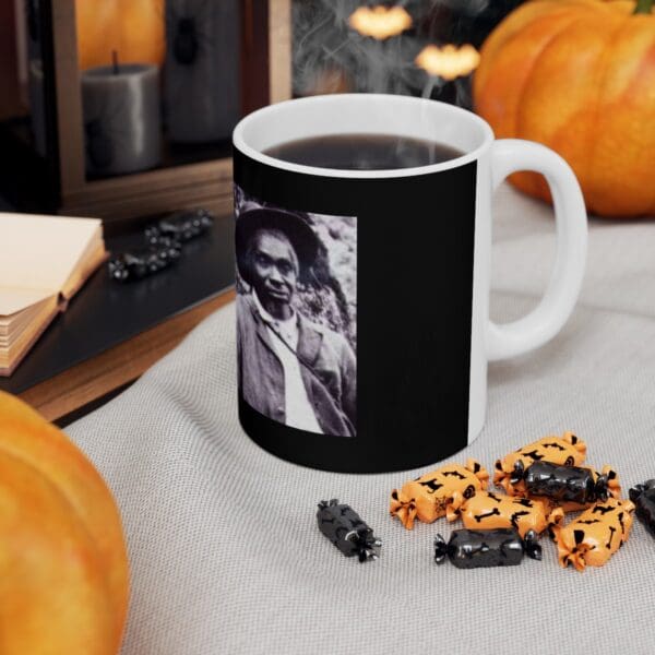 Black mug with a photo of a man.