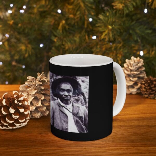 Black mug with a photo of a man.