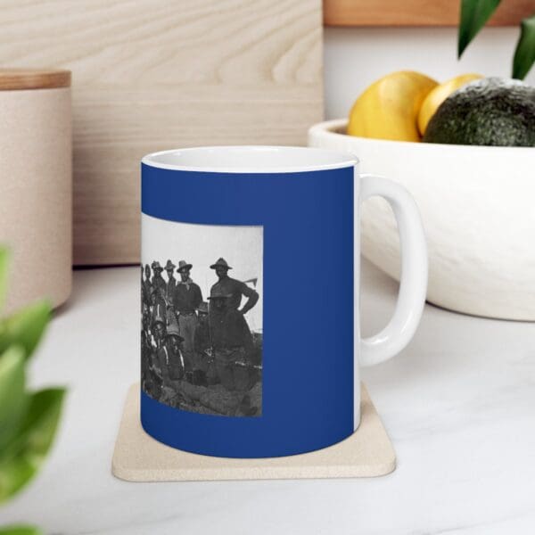 Blue mug with black and white photo of soldiers.