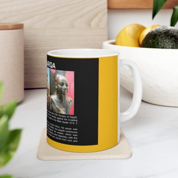 White mug with black and yellow design.